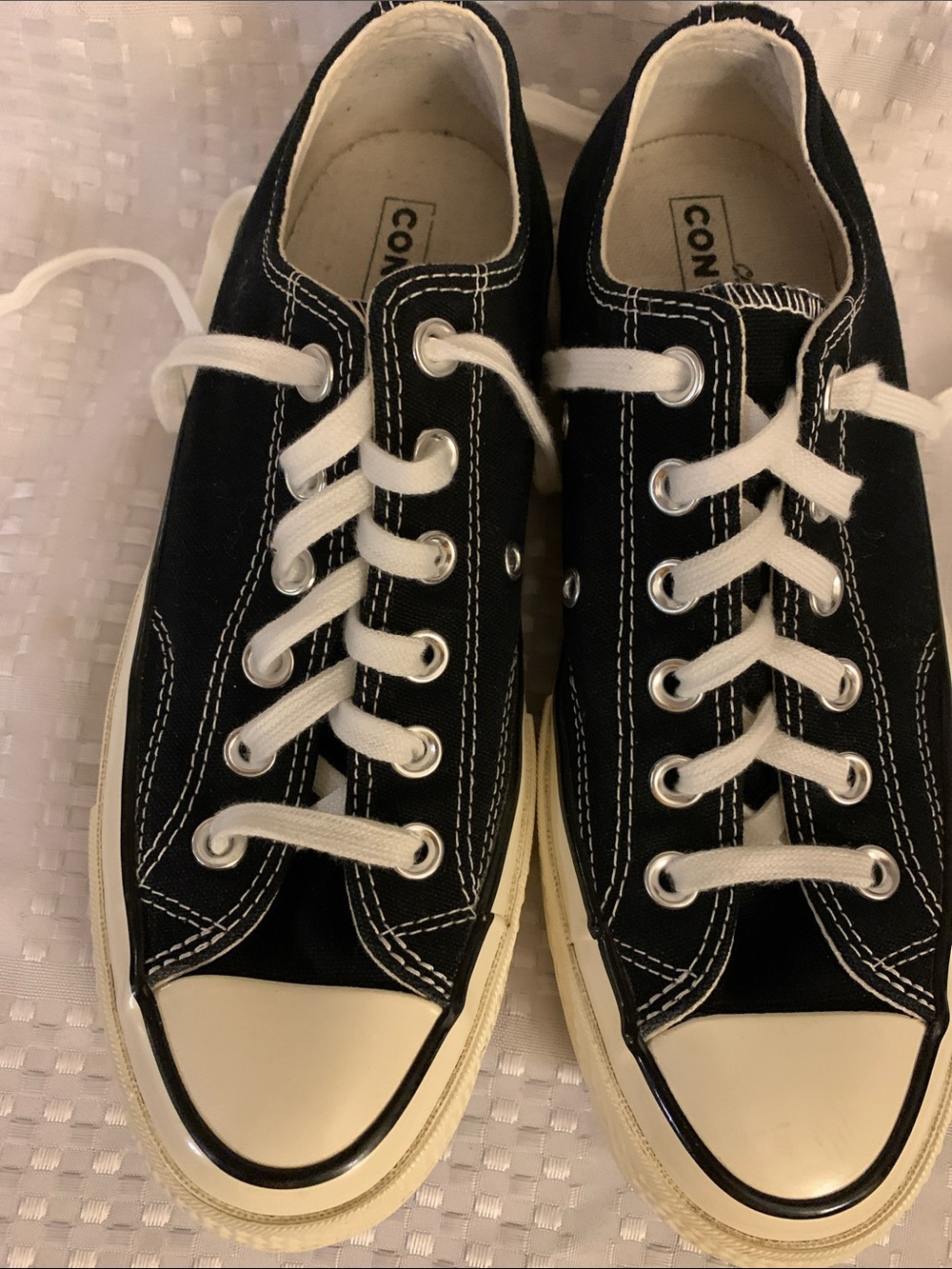 Converse women’s black canvas sneakers with black and white accents, size 7.5.